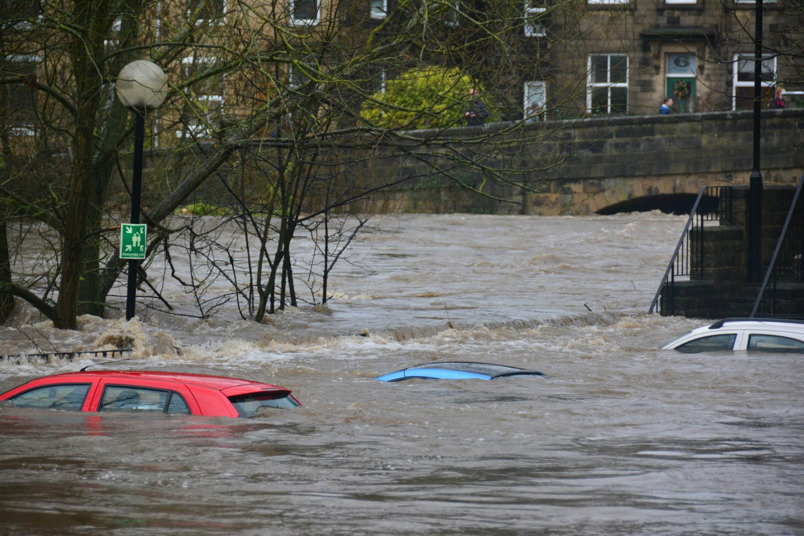 Image of severe flooding with cars under water.